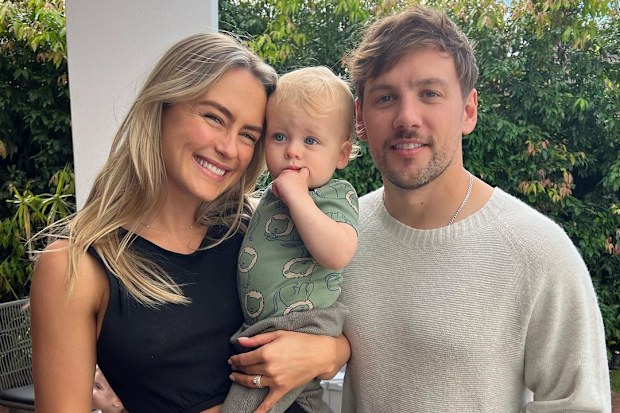 Steph Claire Smith poses with husband Josh Miller and their son Harvey.