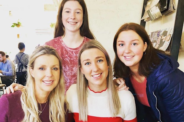Leane Flynn with her three daughters, who were devastated to learn their mum had cancer.
