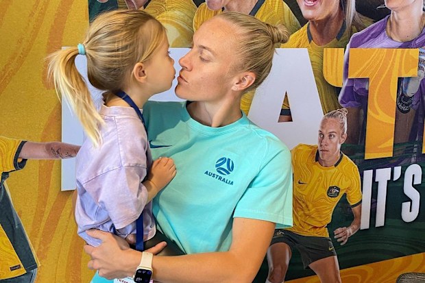 Tameka Yallop of the Matildas with daughter Harley.