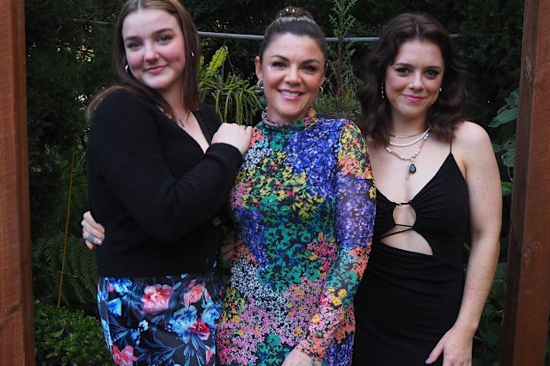 Em Rusciano poses with her daughters Odette (left) and Marchella (right).