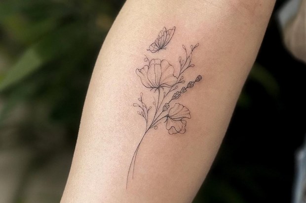 Delicate flower tattoo by Claire Benson.