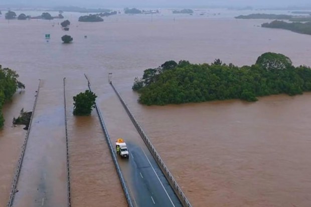 Record-level floods swallow major roads in far north Queensland