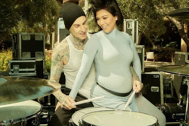 Kourtney Kardashian and Travis Barker, pictured at their gender reveal, have hinted their unborn son might be named Rocky.