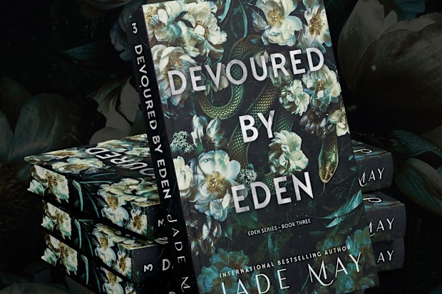 A special edition copy of Jade May's third novel, Devoured by Eden, which features a character with a chronic illness.