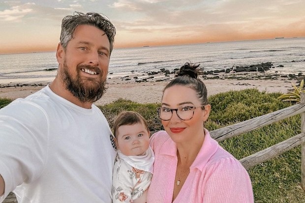 Jade Redmond and husband Craig with their second child, River.