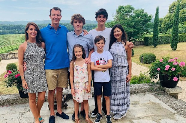 Prince Joachim with wife Princess Marie (far left), ex-wife Countess Alexandra of Frederiksborg (far right) and their children Prince Felix, Prince Nikolai (back) Princess Athena, Prince Henrik (front) at Château de Cayx in July
