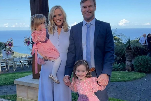 Sam Squiers with husband Ben and their two daughters, Imogen (right) and Elle (left).