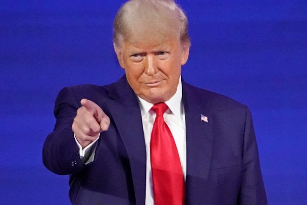 Former president Donald Trump points to cheering supporters as he is introduced before speaking at the Conservative Political Action Conference in February.