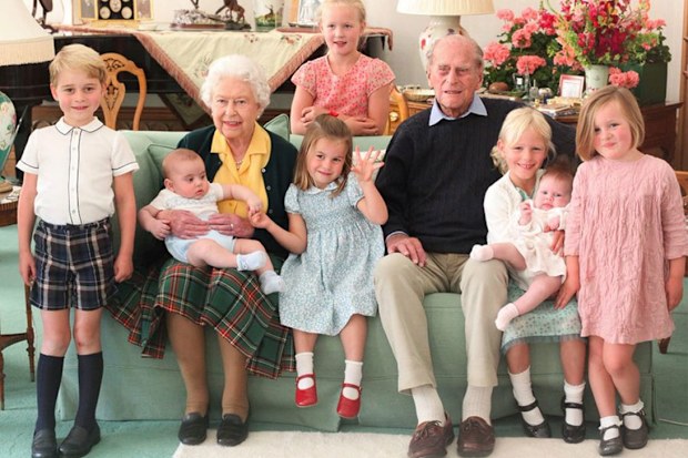 The Queen and Prince Philip surrounded by seven of their great-grandchildren at Balmoral Castle in 2018 (L-R front: Prince George, Queen with Prince Louis, Princess Charlotte, Prince Philip, Isla Phillips, Lena Tindall, Mia Tindall. Back: Savannah Phillips)
