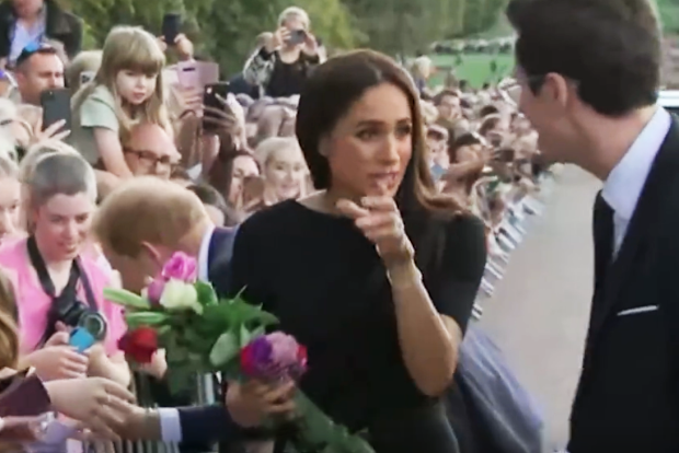 meghan markle speaks with royal aide outside windsor castle