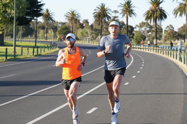 Reece Edwards (right) running at Melbourne's Albert Park with training buddy Dave Ridley.