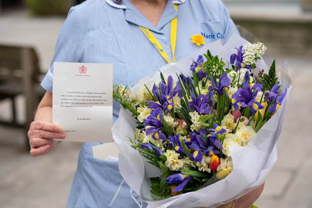 General view of flowers from Queen Elizabeth II to staff at St Bartholomew's Hospital, London, on the anniversary of the first national lockdown to prevent the spread of coronavirus. (Photo: March 23, 2021)