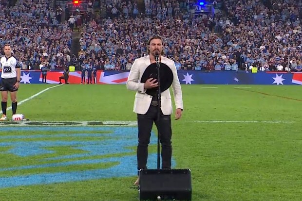 Robbie Mortimer singing national anthem 
