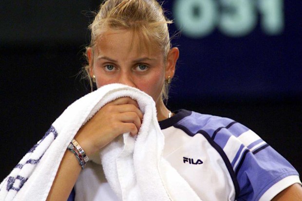 Jelena Dokic of Australia wipes her face during her match against Tamarine Tansasugarn of Thailand during  the Hopman Cup Tennis Teams Championships, held at the Burswood Casino in Perth, Australia. Tanasugarn won 6-1, 6-4. Mandatory Credit:Stuart Milligan/ALLSPORT