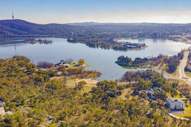 Panorama view of Canberra, the capital city of Australia, looking north over Lake Burley Griffin with Black Mountain and Telstra Tower to the left and Commonwealth Bridge at right