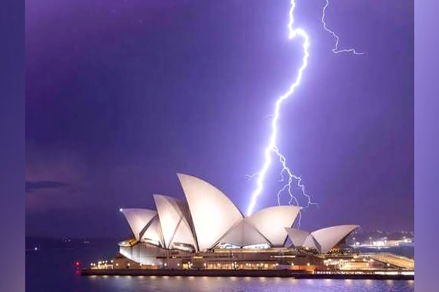 New South Wales was battered last night by an unseasonal storm that unleashed 100,000 lightning strikes across the state.