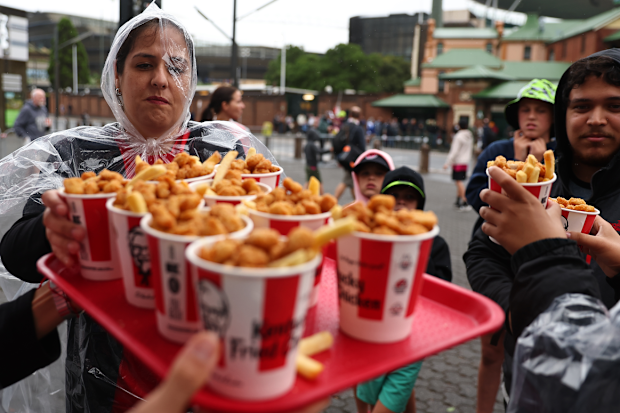 SYDNEY, AUSTRALIA - JANUARY 17: Fans enjoy KFC at the truck prior to the BBL match between Sydney Sixers and Sydney Thunder at Sydney Cricket Ground, on January 17, 2025, in Sydney, Australia. (Photo by Jeremy Ng/Getty Images)