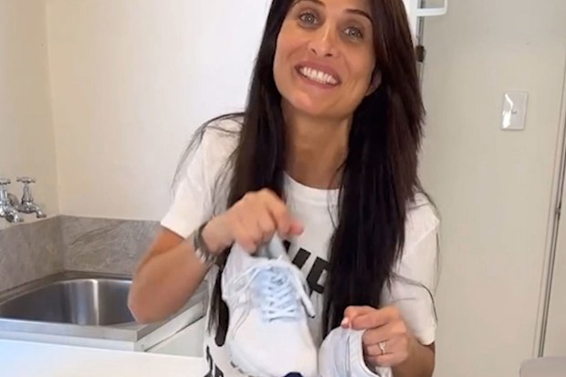Professional organiser Anita Birges' with sneakers she's just cleaned using a DIY paste.