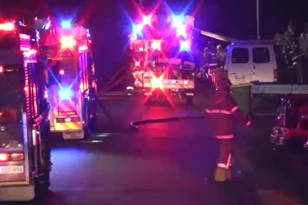 A woman has been rescued after she was trapped in a house fire. (9 News)