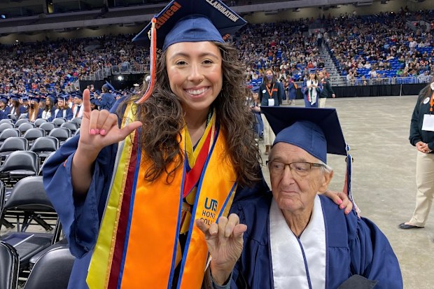 Grandfather and granddaughter grad