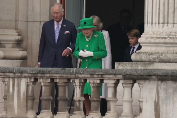 Prince Charles, Prince of Wales, and Queen Elizabeth II stand on the balcony during the Platinum Jubilee Pageant in front of Buckingham Palace, on day four of the Platinum Jubilee celebrations on June 05, 2022 in London, England. 
