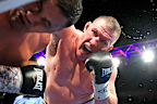 Paul Gallen throws a punch at Justin Hodges.