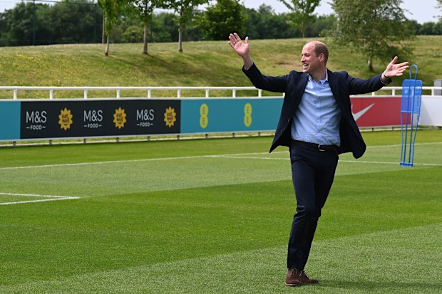 Prince William, Duke of Cambridge celebrates after scoring a goal whilst visiting the England Women's football team at St. George's Park on June 15, 2022 in Burton upon Trent, England. 