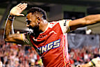 Hamiso Tabuai-Fidow of the Dolphins celebrates after scoring against Canberra.