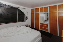 The windows were taped shut to keep the room dark, cold and unventilated.