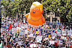Demonstrators march in the "No Kings" protest with a President Donald Trump balloon in Los Angeles
