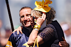 Damien Oliver is hugged by a representative of Alenquer before Race 7, the Lexus Melbourne Cup, during Melbourne Cup Day at Flemington Racecourse.