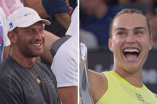 Aryna Sabalenka laughs while speaking to the crowd.