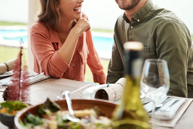 A couple sitting down for a meal on Christmas day