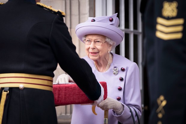 Queen Elizabeth II attends an armed forces act of loyalty parade in the gardens of the Palace of Holyroodhouse, Edinburgh, Tuesday, June 28, 2022. 