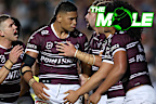 Haumole Olakau'atu is swamped by teammates as they celebrate a crucial try for Manly against the Eels.