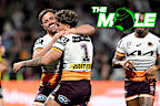 Broncos players rush to celebrate with Reece Walsh after a try against the Rabbitohs.