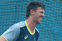 Mitchell Marsh reacts after being struck by the ball during a training session.