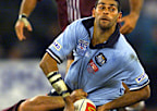 David Peachey is tackled during his only State of Origin game, in 2000.