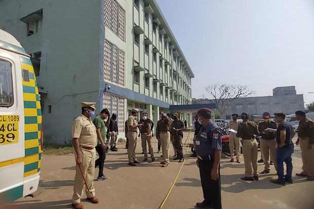 Police officers investigate the scene after a fire broke out at District General Hospital in Bhandara, about 70 kilometres from Nagpur, India, Saturday, Jan. 9, 2021.