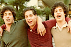 Three identical triplets born on July 12, 1961, were separated at birth and given to three different families.