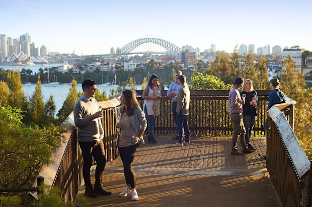 The Roar and Snore experience starts with a welcome drink overlooking Sydney Harbour.