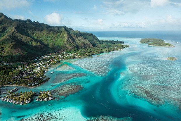 An aerial view of French Polynesia Moorea tropical island on a sunny day