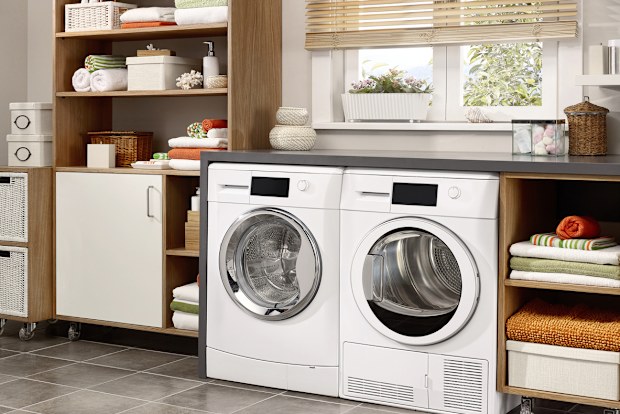 Domestic laundry room with washing machine and dryer