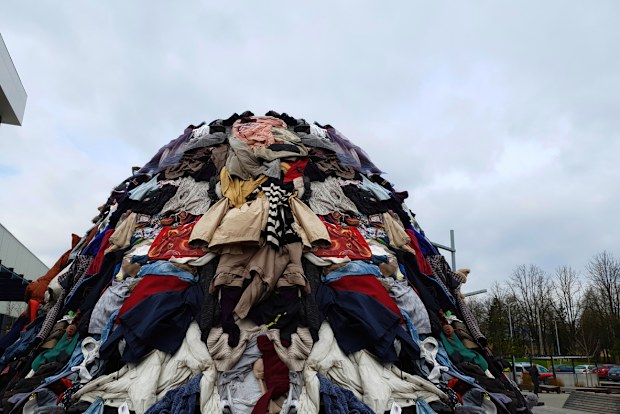 waste pile large pollution heap fashion industry trash in nature landscape garbage stack of cloth industrial pollution awareness global pollution background