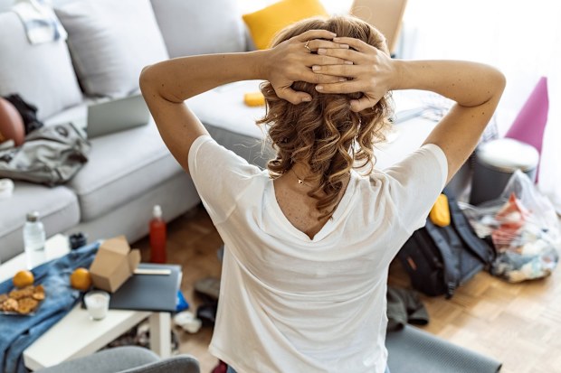 woman frustrated cleaning home