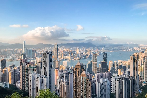 Aerial view of West Kowloon city skyline, Hong Kong. West Kowloon cityscape with skyscrapers and harbour.