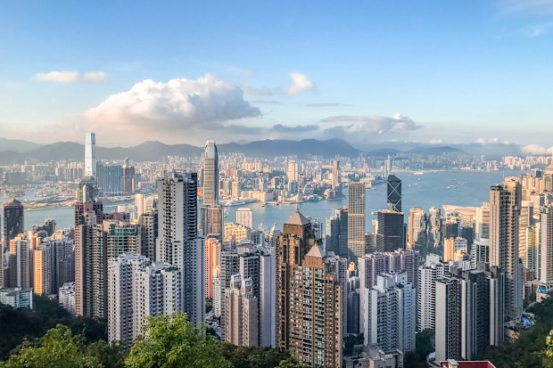 Aerial view of West Kowloon city skyline, Hong Kong. West Kowloon cityscape with skyscrapers and harbour.