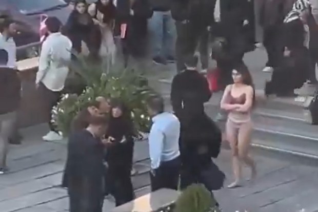 A female student stripped to her underwear outside her university in Iran in what some student and rights groups say was a protest against the country's strict Islamic dress code.