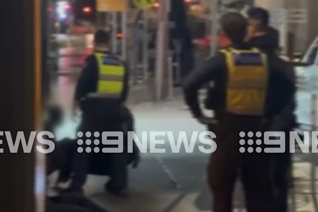 Vision captured the moment police busted two people allegedly pouring accelerant into the ACDC Lane venue.