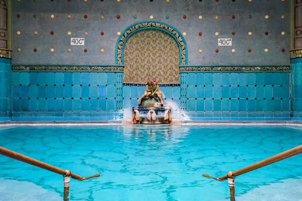 Spectacular design and architecture of Gellert Spa in Budapest, Hungary. Empty therapeutic thermal pool with beautiful blue and turquoise tiles.